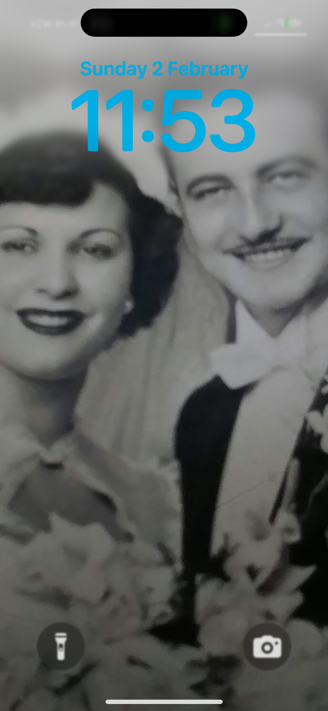 A man and woman smiling