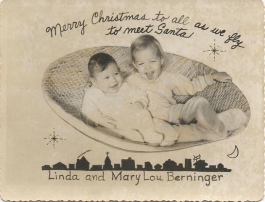 Two delighted children sit together, warmly anticipating their meeting with Santa during Christmas.