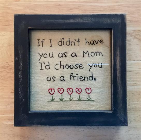 A touching quote about choosing a mother as a friend, framed with a floral design.