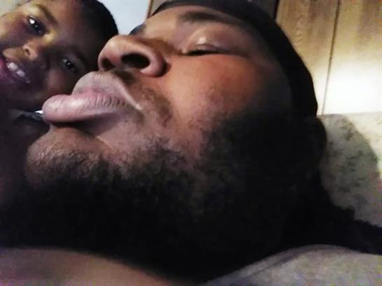 Two friends are enjoying a light-hearted moment together indoors, showing friendship and fun.