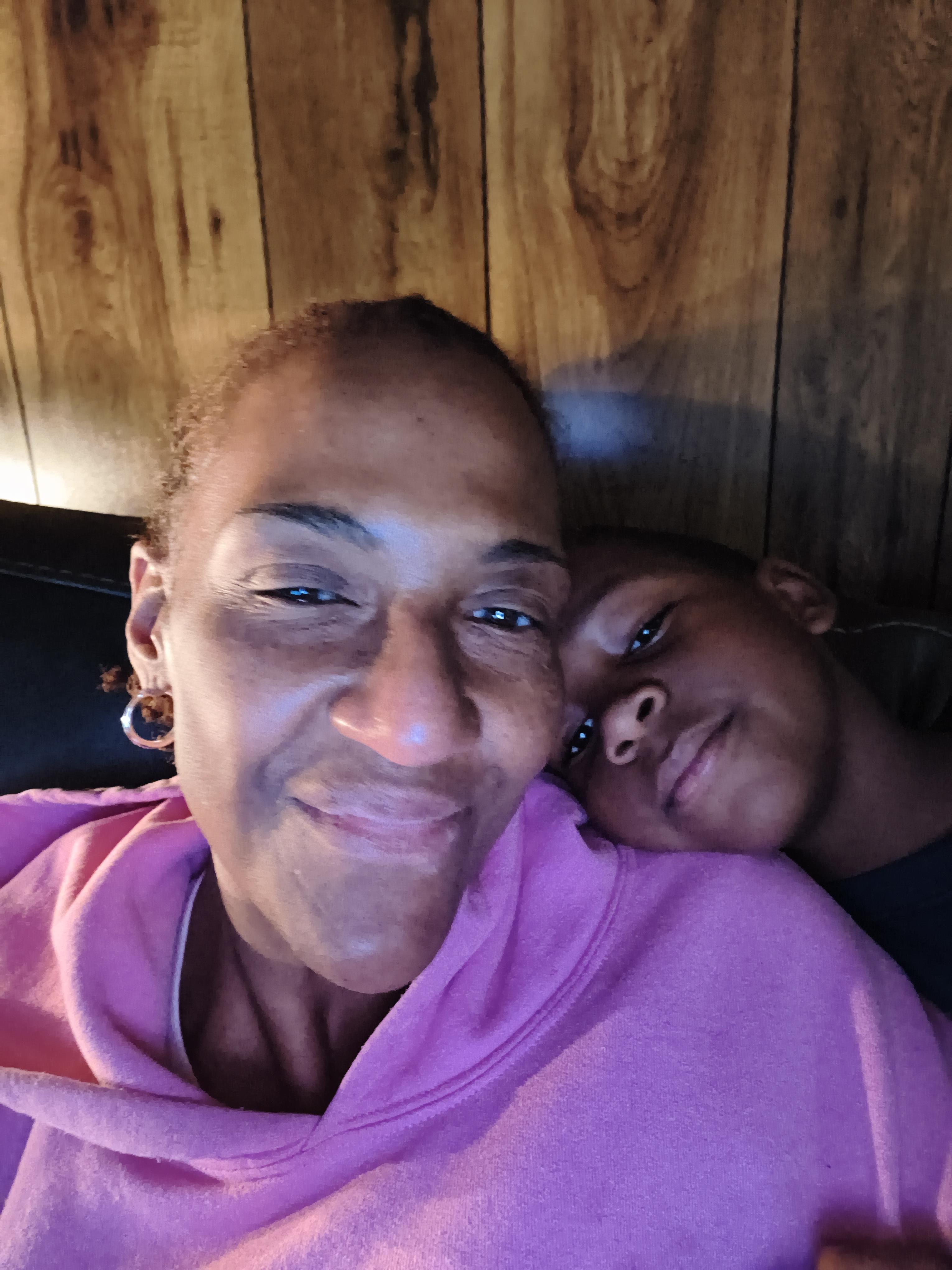 A woman and a boy taking a selfie