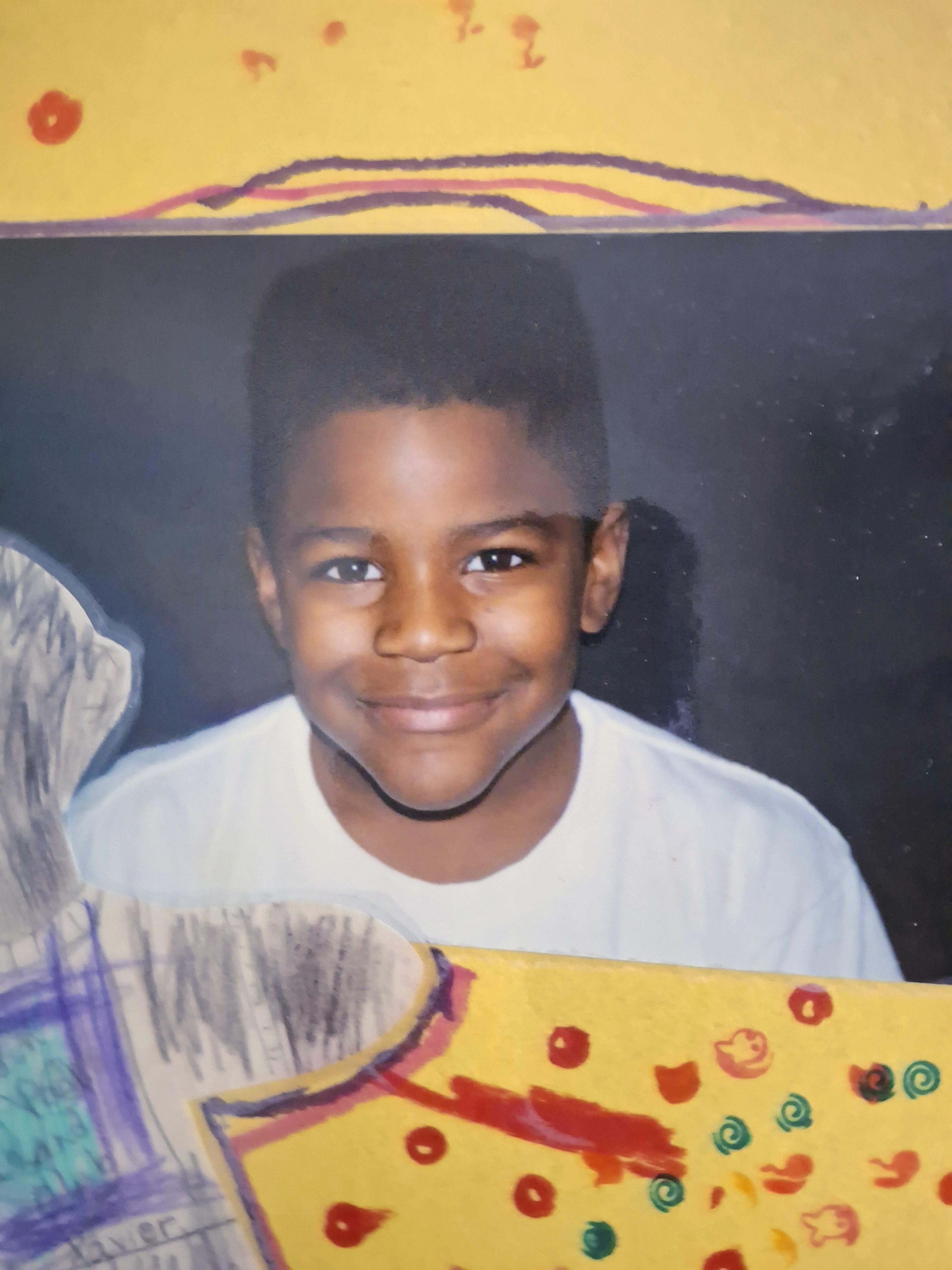A boy smiling at the camera