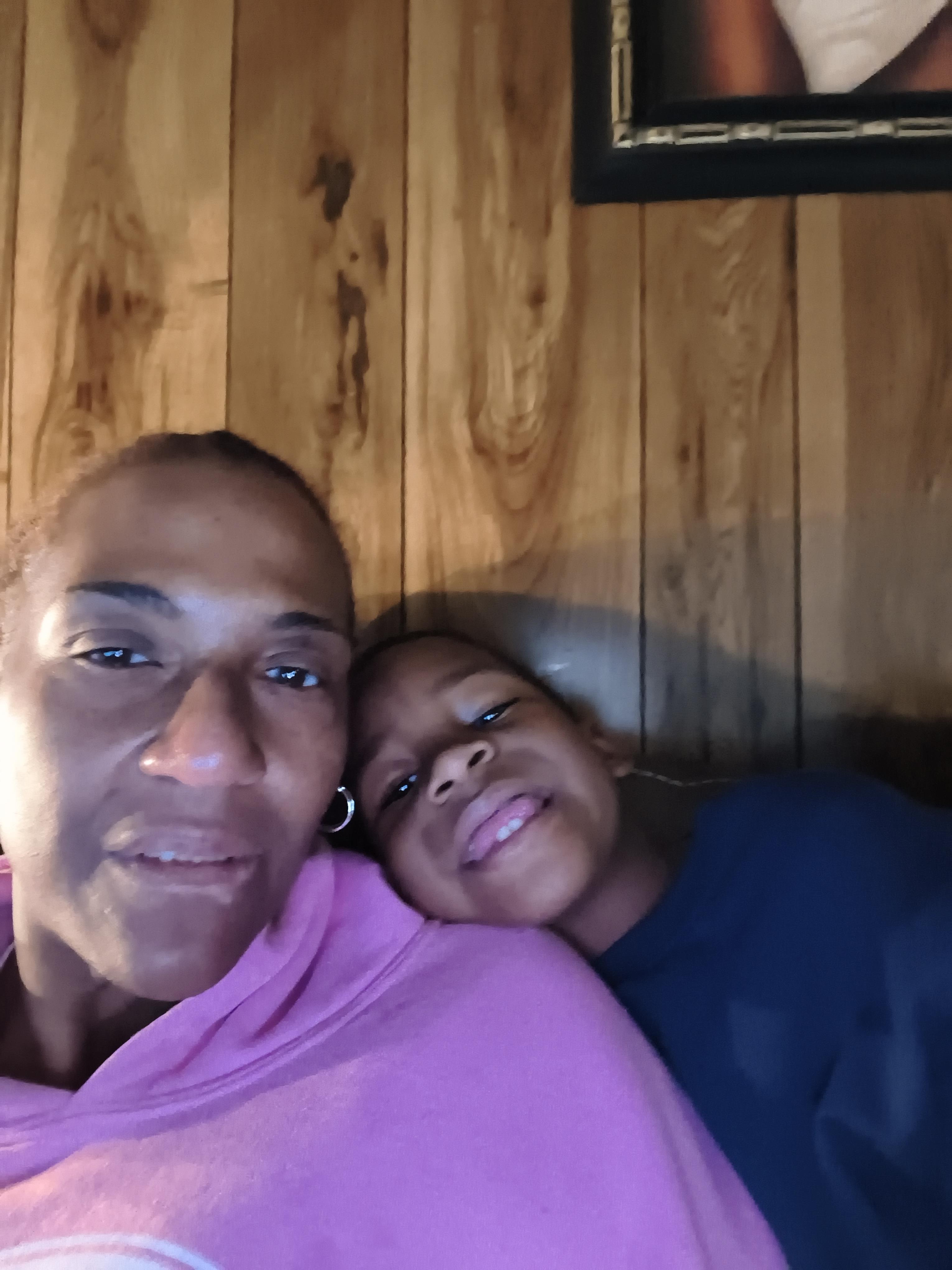 A woman and a child taking a selfie