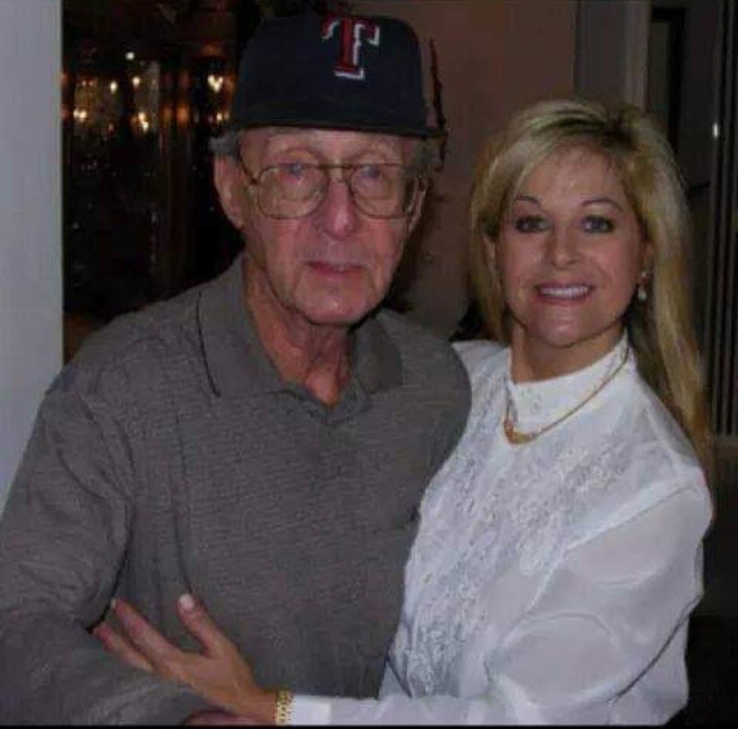 A man and woman share a joyful moment together in a cozy environment.