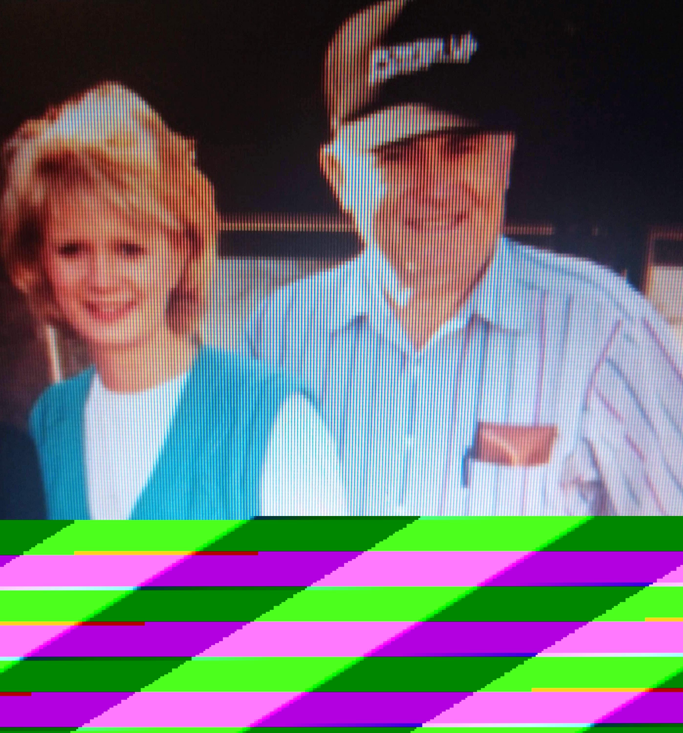 A man and woman smiling