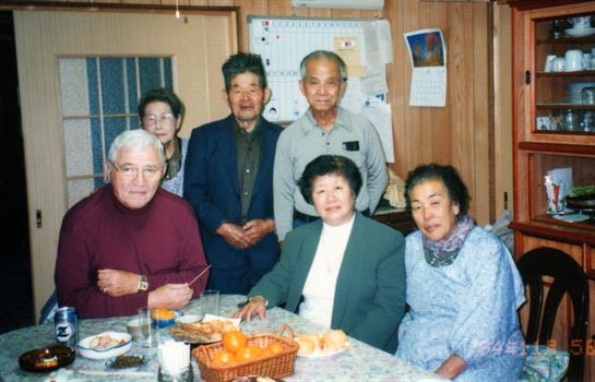 Friends share a special meal together, enjoying each other's company in a warm, inviting atmosphere.