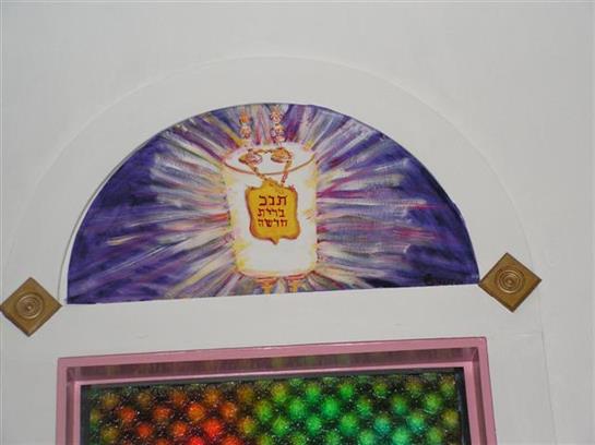 Artwork features a candle glowing with vibrant colors and intricate designs for a festive vibe.