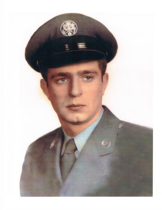 A young man poses confidently in a military uniform, exuding a sense of honor and commitment.