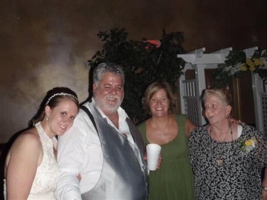 Loved ones celebrate a wedding under a starry sky, cherishing love and friendship.