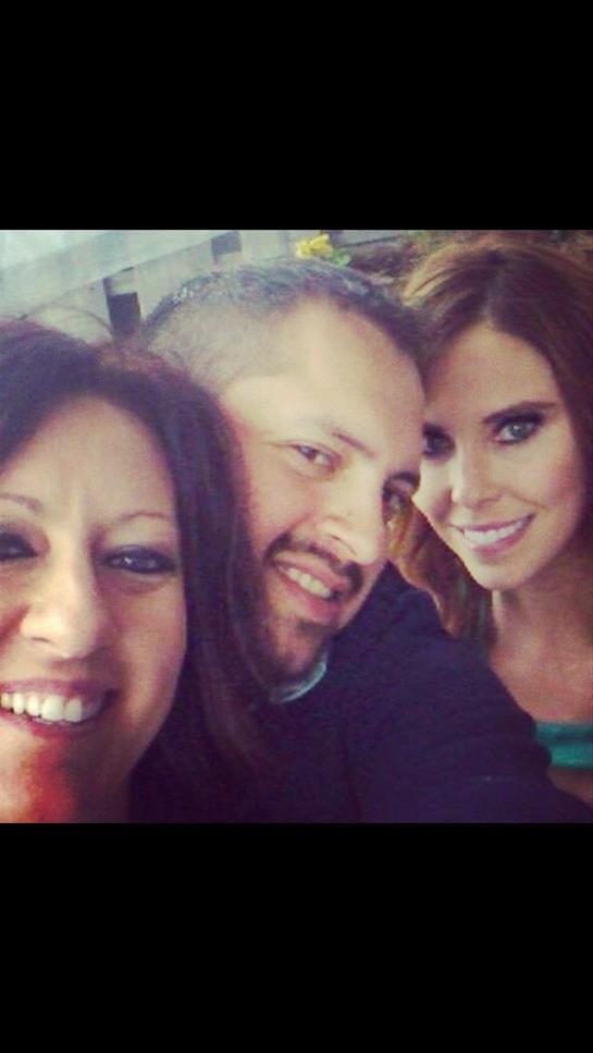 Three friends share smiles and laughter during a fun gathering in a cozy setting.