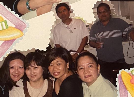 Friends gathered at a restaurant, sharing smiles and enjoying the celebration together.