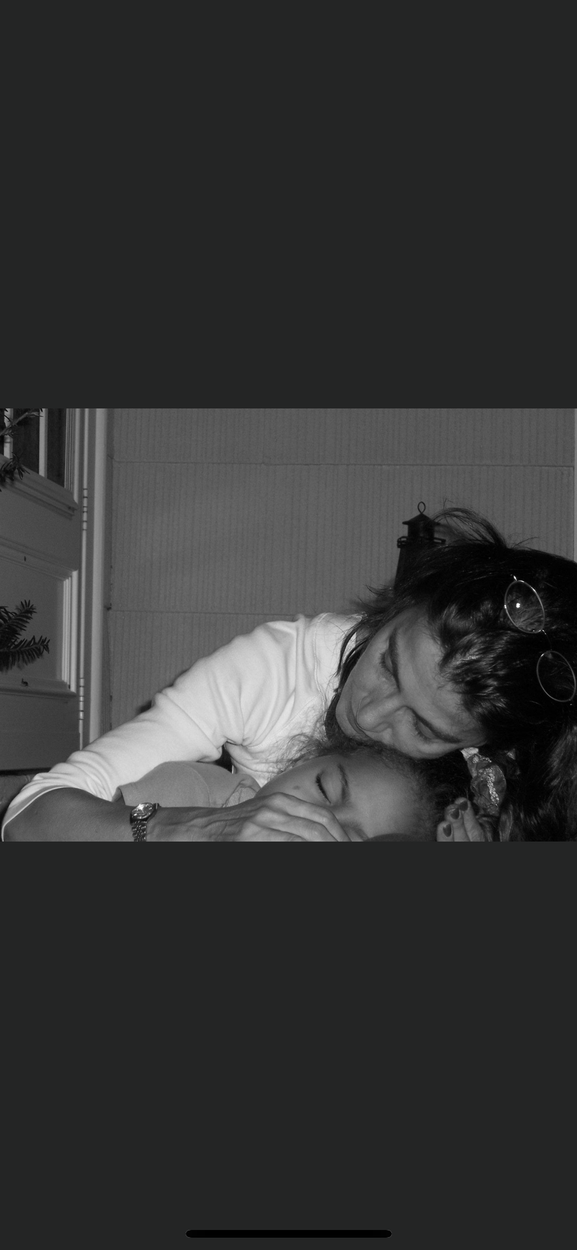 A woman and child cuddling