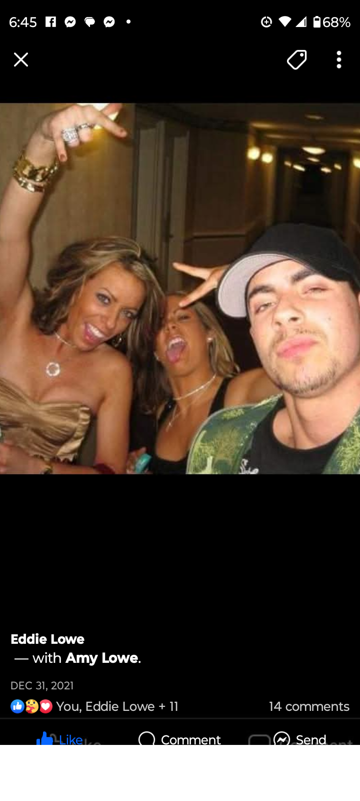 Group of friends celebrating together with joyful expressions and playful gestures indoors