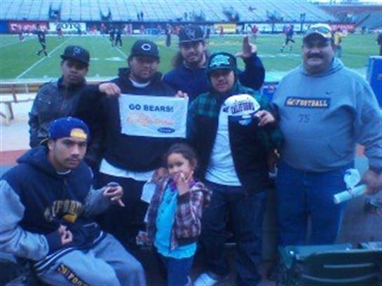 Group of fans proudly displays a sign in support of their favorite football team at the stadium.