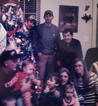 Family members enjoy a cheerful Christmas celebration surrounded by festive decorations.