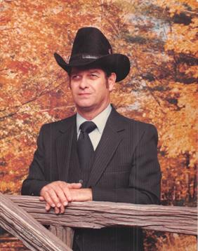 A cowboy leans on a wooden fence, surrounded by colorful autumn leaves, radiating confidence.