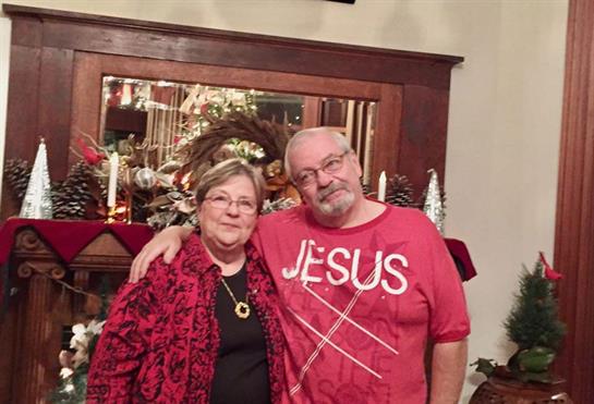 Couple enjoys quality time together amid holiday decorations at their home.
