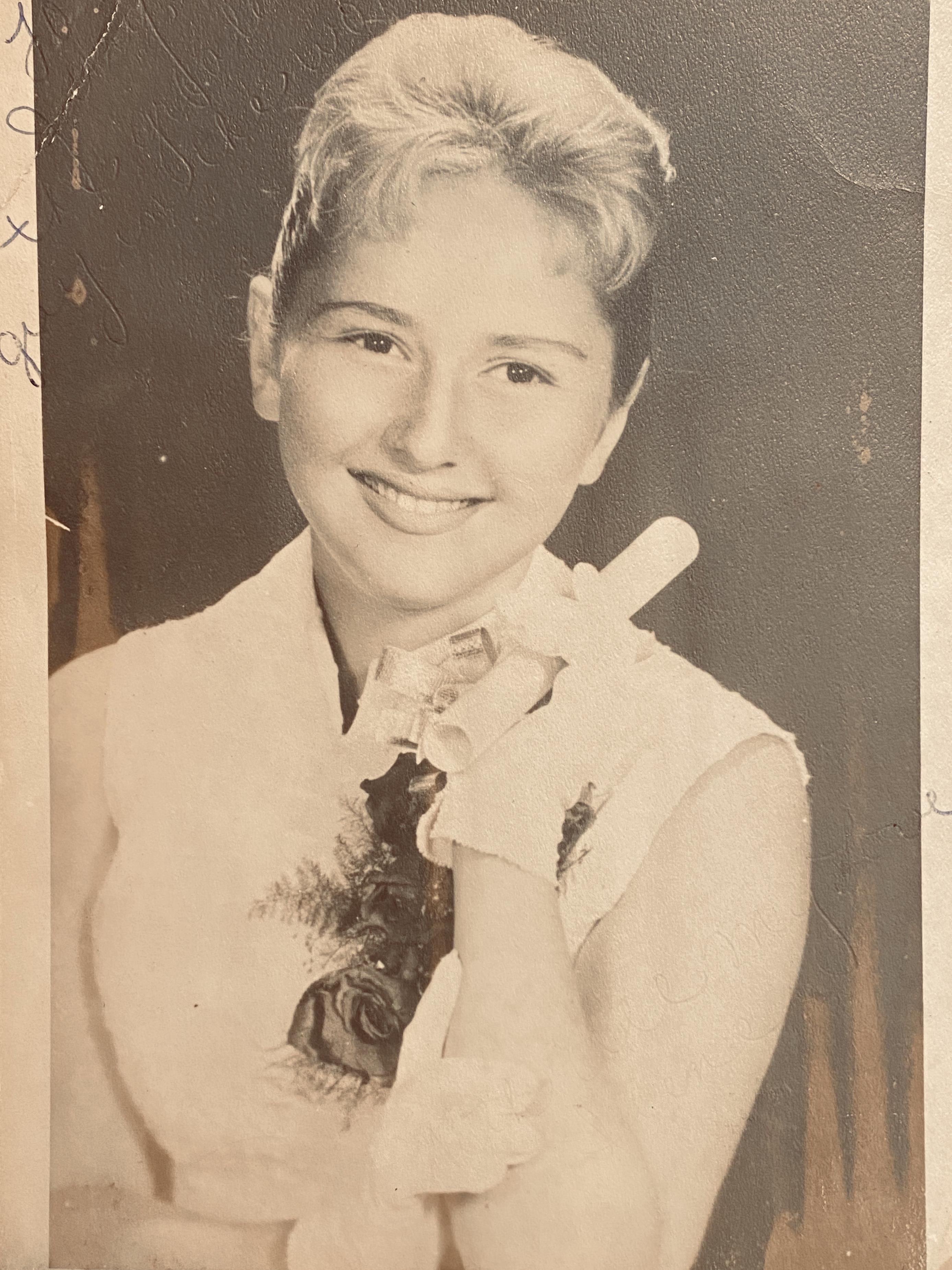 A black and white photo of a young woman smiling