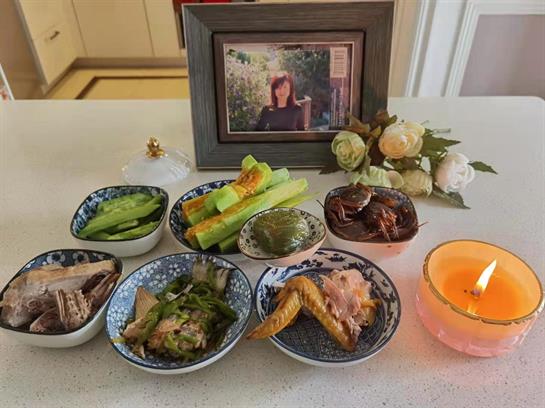 A lovely display of traditional dishes with a treasured family photo in a calm setting.