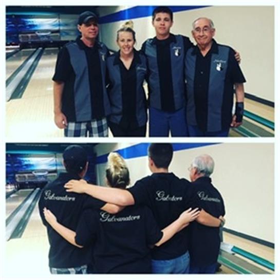 Four family members enjoy an evening of bowling together, wearing matching shirts and smiles.