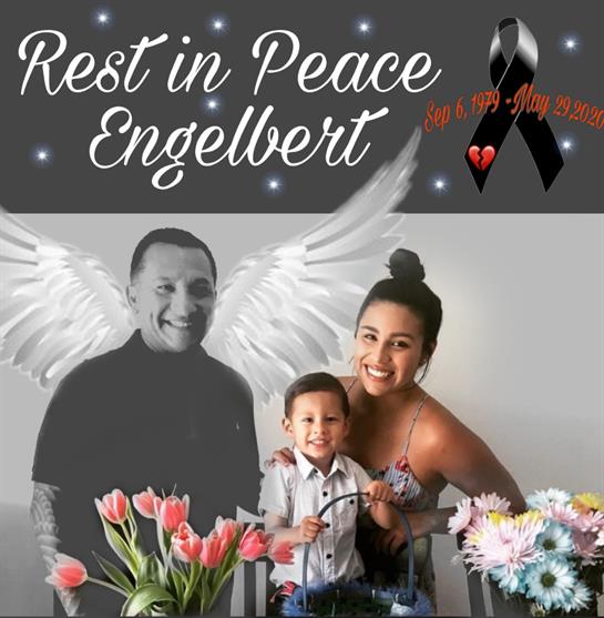 A grieving family gathers to honor Engelbert, surrounded by flowers and memories of love.