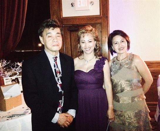 Three friends pose together in stylish outfits, enjoying a night of celebration and camaraderie.