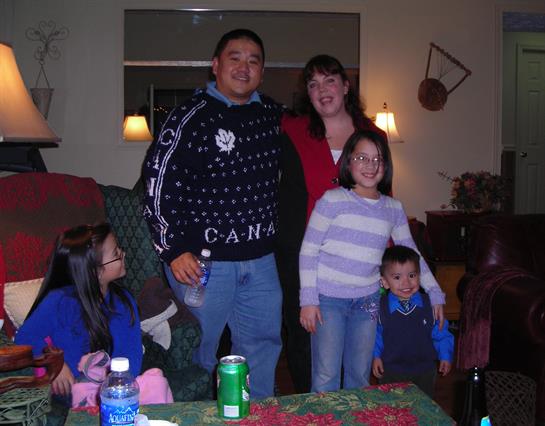 Families gather in a cozy living room, enjoying winter festivities together.