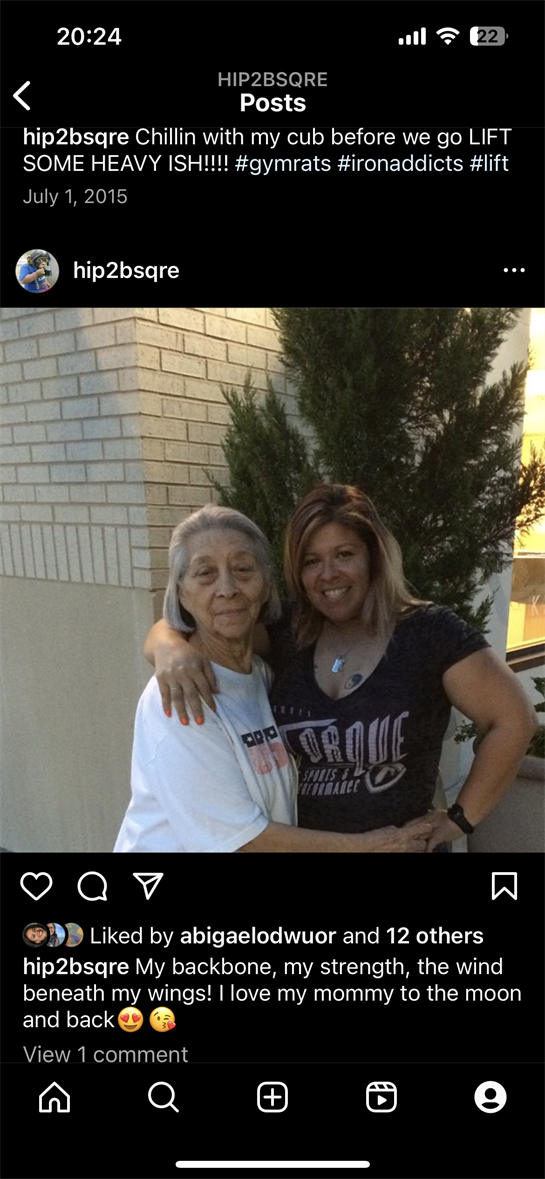 A granddaughter embraces her grandmother outside their home, enjoying quality time together.
