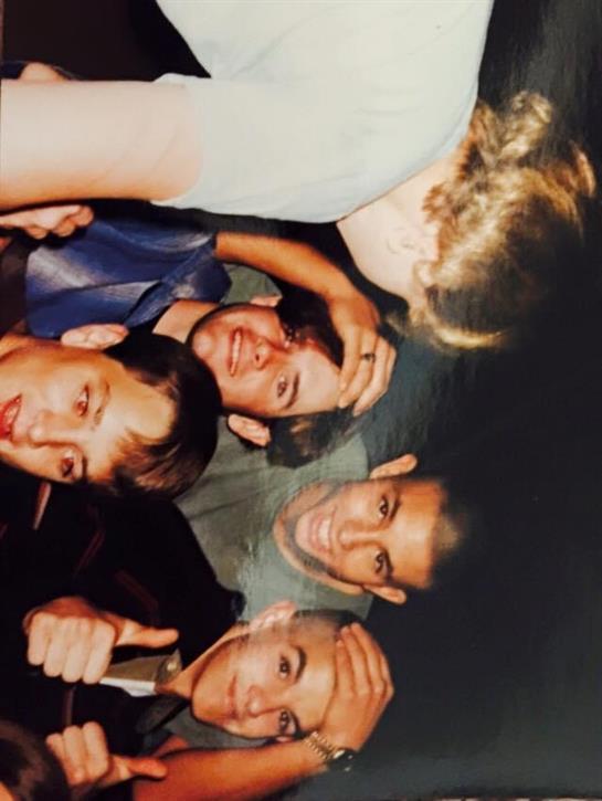 Friends gather for a lively evening, sharing laughter and good times under the stars.