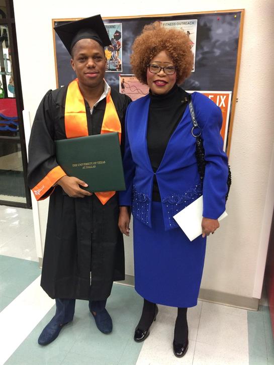 Student celebrating graduation in cap and gown alongside supportive parent holding diploma.