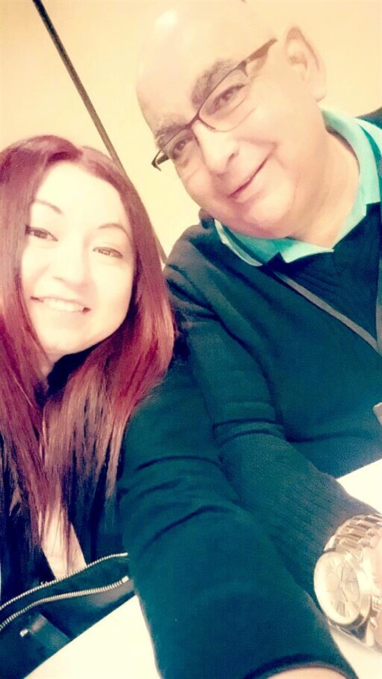 Two friends enjoy a cheerful moment together, capturing smiles and laughter at a cafe.