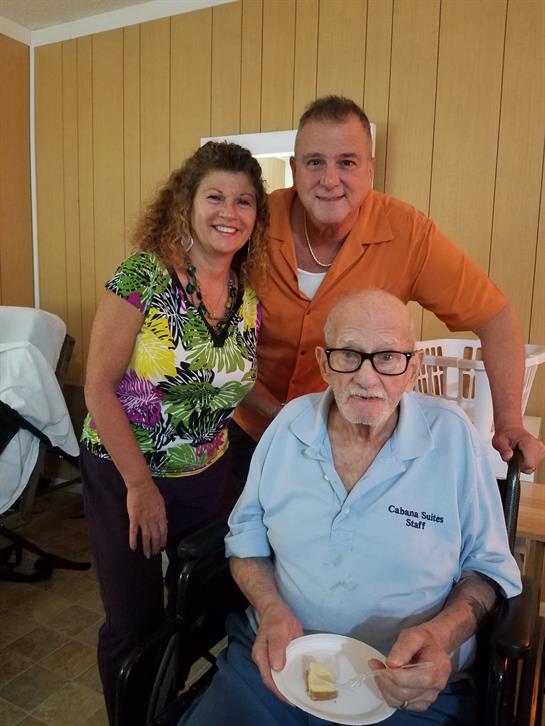 A cheerful family poses together, showcasing their love and connection during a gathering.