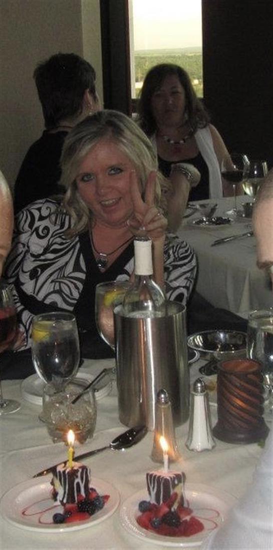 Friends gather at a stylish restaurant, enjoying drinks and laughing together during dinner.