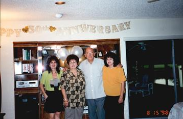 Joyful family and friends celebrate a meaningful anniversary in a cozy home setting.
