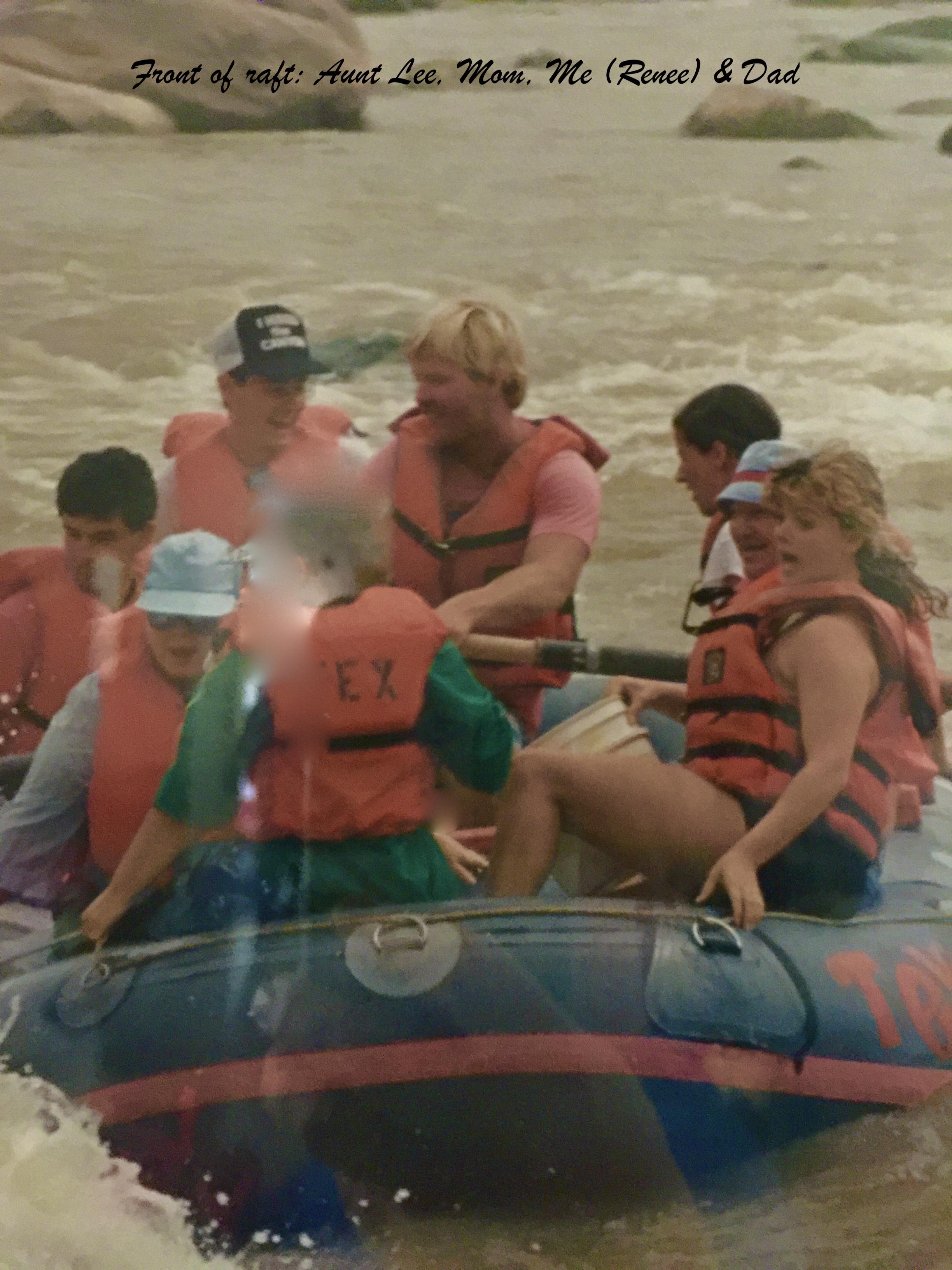 People are in a raft, wearing life jackets, navigating through river rapids with joy.