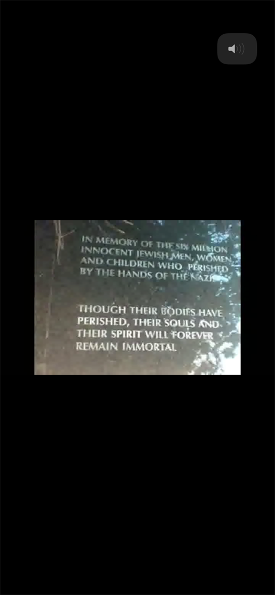 A somber memorial honors the six million Jewish victims in a moment of remembrance.