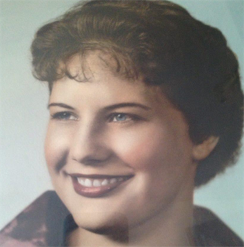 A young woman with a joyful expression poses in a vintage portrait, reflecting a 1950s style.