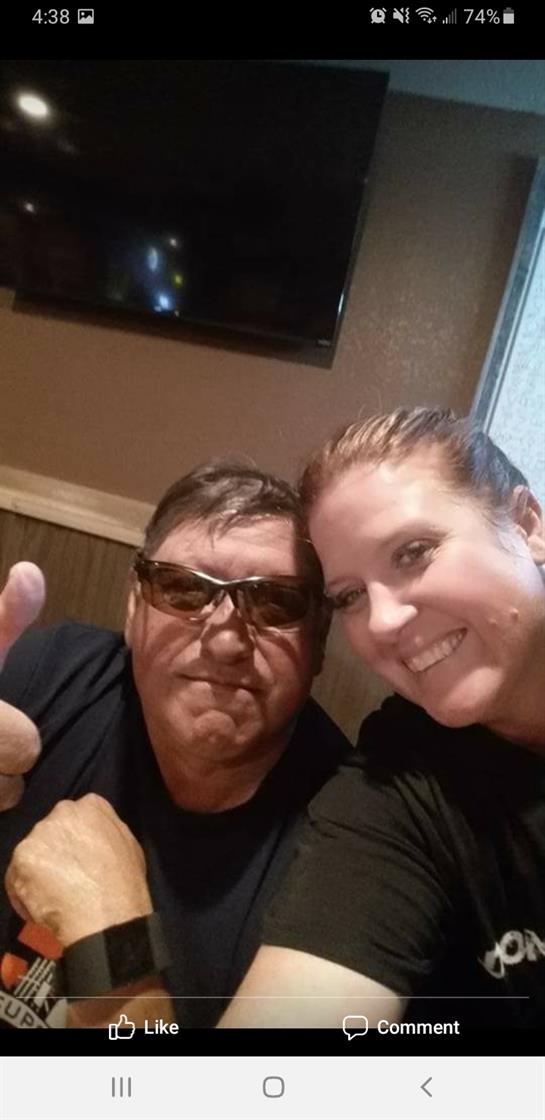Two friends share a fun moment taking a selfie together in a casual spot.