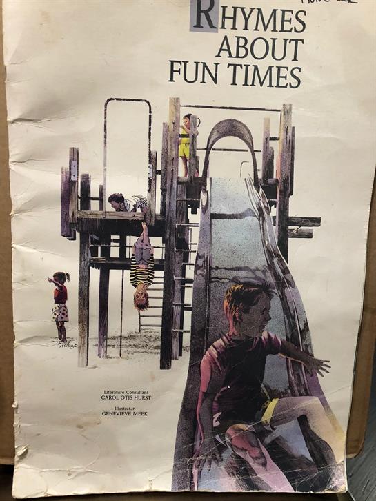 Kids play joyfully on slides and climbing structures in a community park under clear blue skies.