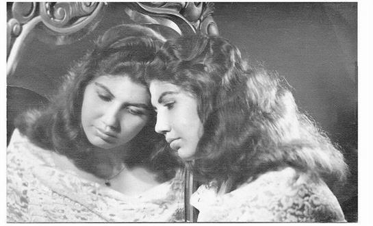 A woman gazes into a mirror, lost in thought, surrounded by a serene atmosphere.