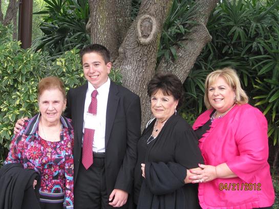 Relatives pose together in a vibrant garden, enjoying a joyful family moment under the sun.