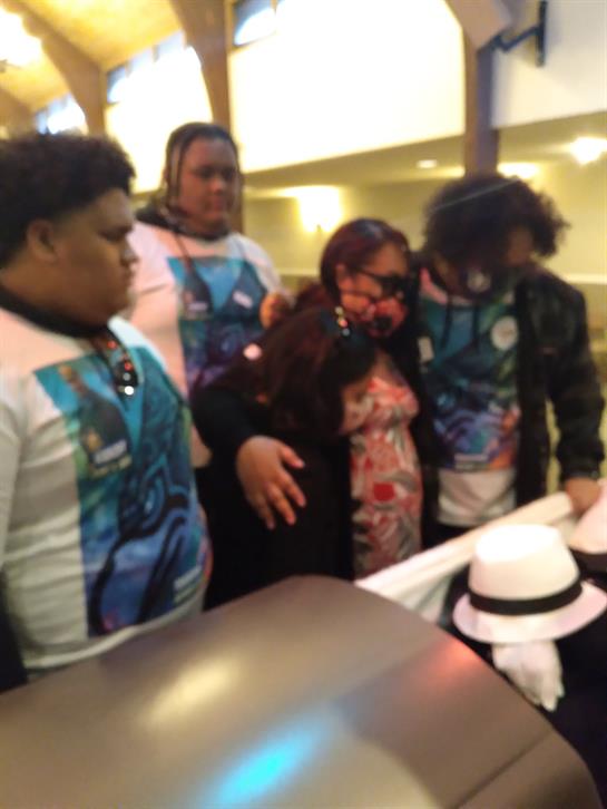 Friends gather around a table at a local restaurant, sharing laughs and conversation.