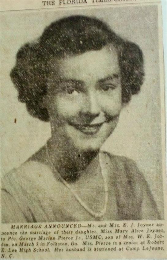 A young woman smiles warmly, showcasing classic vintage beauty from a bygone era.