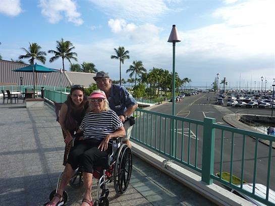 Family spends quality time outdoors by the harbor, enjoying the warm weather and beautiful views.