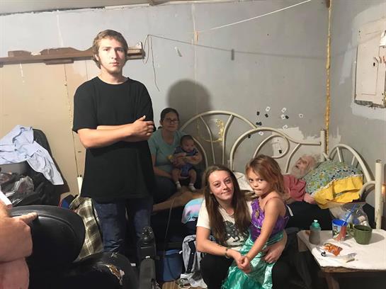 A warm gathering of family members in a relaxed indoor environment sharing joyful moments together.