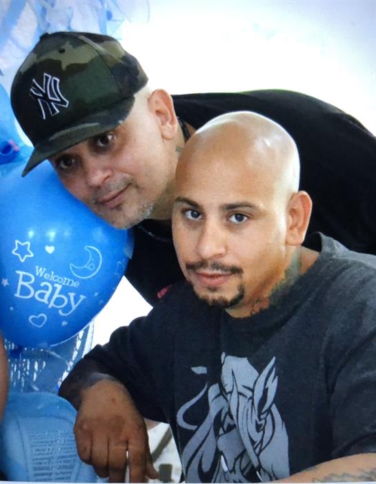 Two friends pose together, showcasing joy and camaraderie while celebrating a special moment.