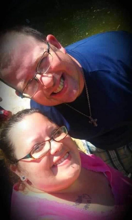 Two friends share a sunny outdoor selfie, capturing their joyful expressions.