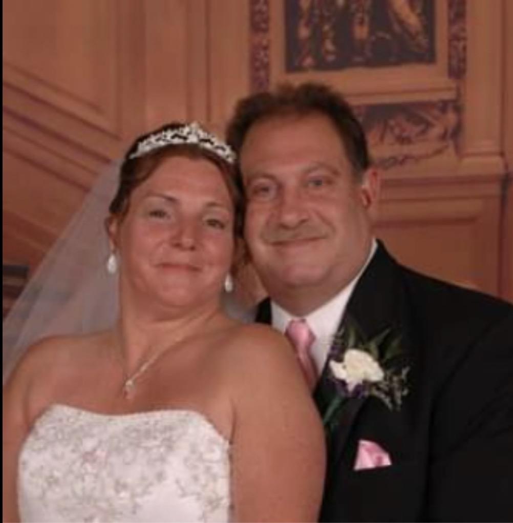 A man and woman posing for a picture