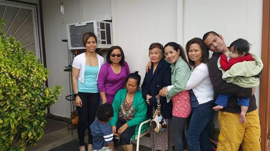 Several women stand and sit together, enjoying quality time in a cheerful environment.