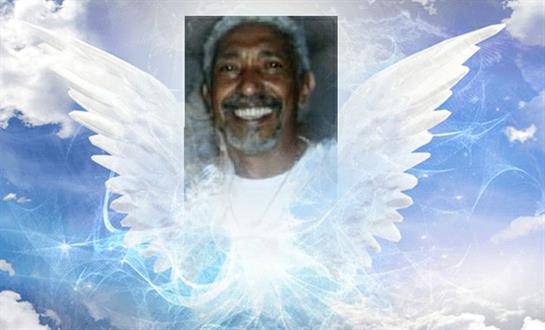 A smiling man with angelic wings against a calm, ethereal background exudes peace.